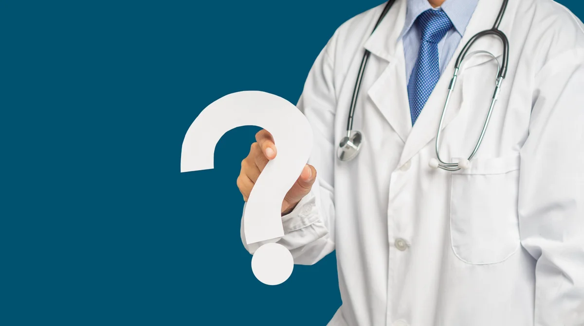 Doctor holding a question mark